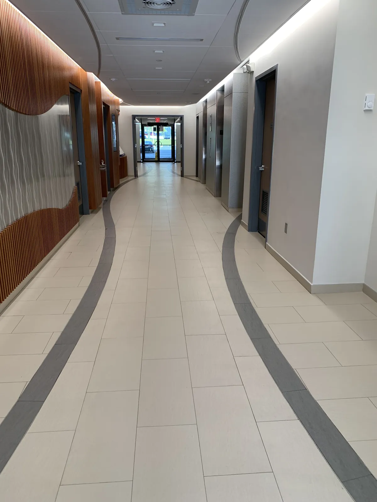 Long office corridor with polished tile